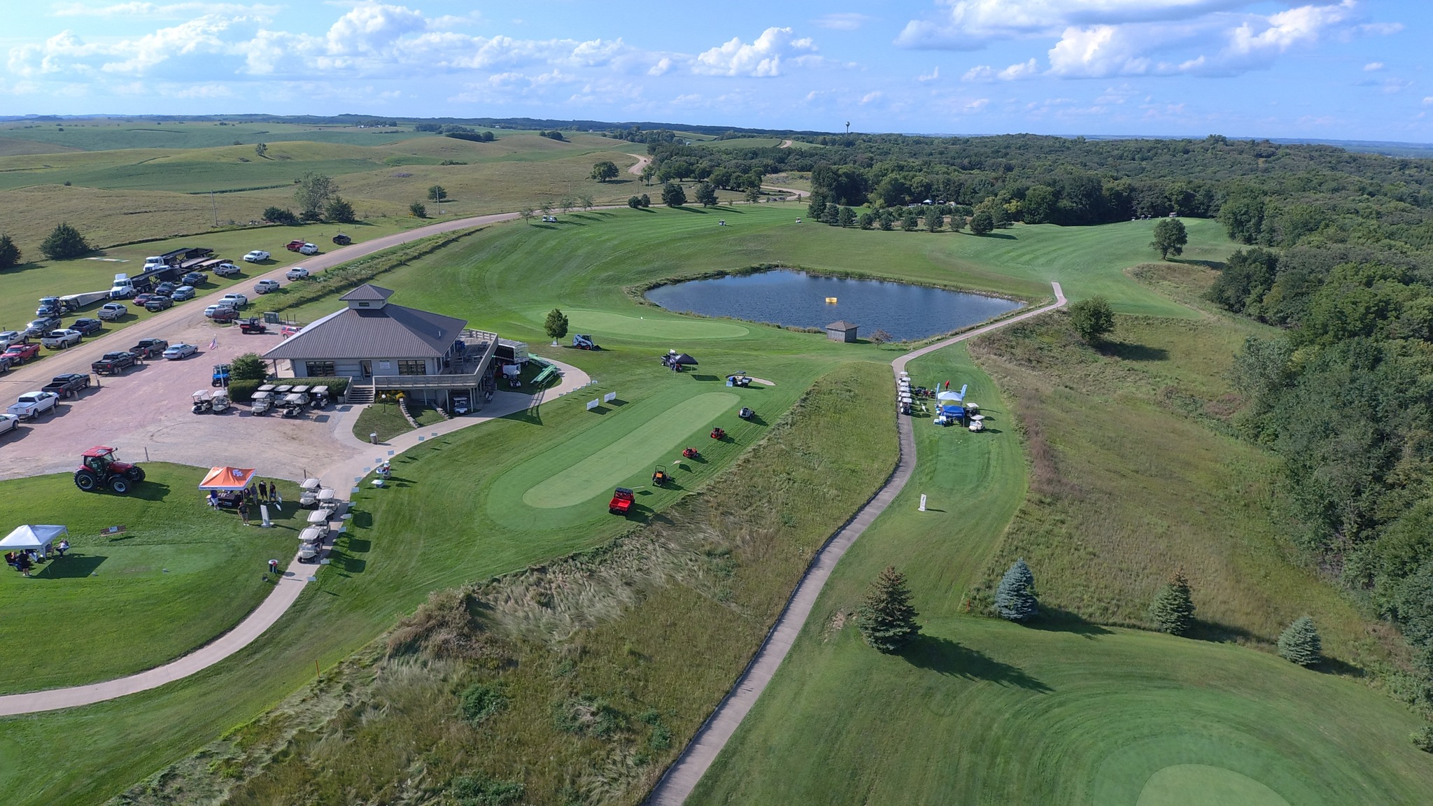 Image of golf ball on tee on grass.